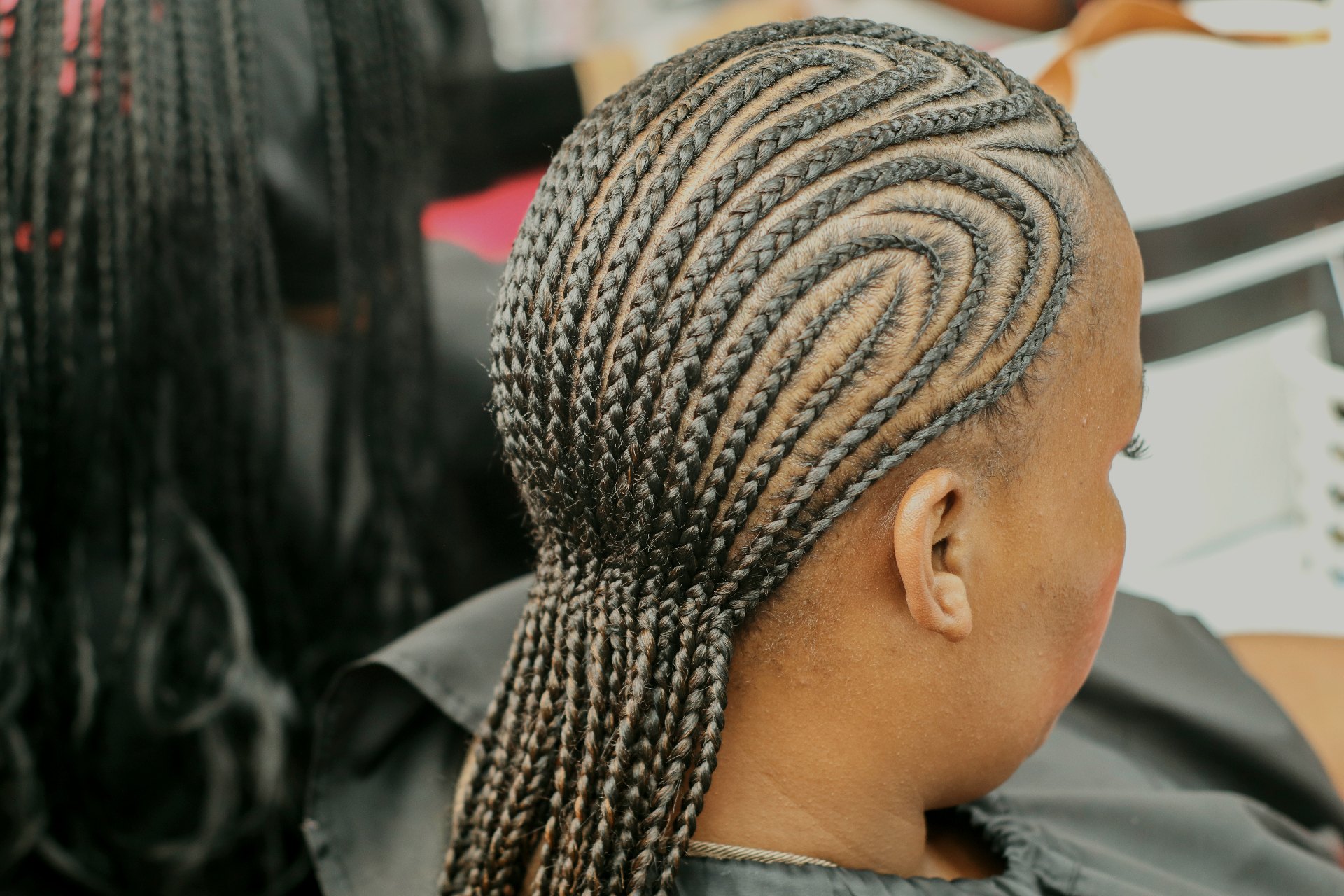 Feed-in cornrow braids styled at Vinci Crown